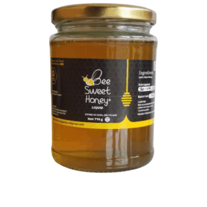 Bee Sweet Raw Honey 710g in clear glass jar, 1005 raw Jamaican honey